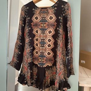 lightweight long sleeve dress. Above the knee. Deep V in the back and pockets.